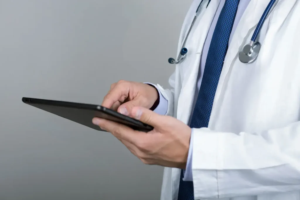 close-up-male-doctor-s-hands-touching-digital-tablet-pc-healthcare-medical-concept.jpg (1)